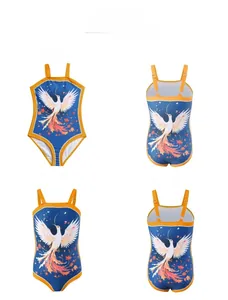 Detail of girls one-piece swimsuit with blue phoenix print and yellow shoulder straps