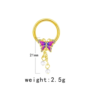 Détail d'un anneau de sein papillon doré avec émail violet, perles et dimensions