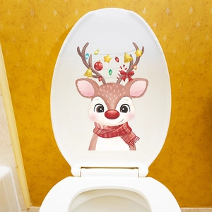 Detailed view of a cute Christmas reindeer decal applied on a white toilet lid cover