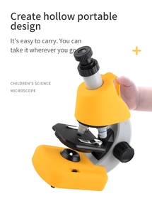 Detail of portable science microscope for kids featuring a yellow ergonomic handle design