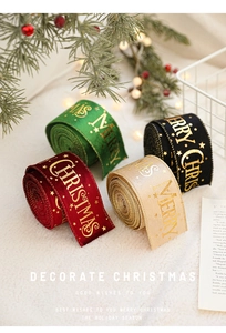 Detail of velvet Christmas ribbons with gold Merry Christmas print and star patterns
