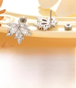 Detailed view of silver maple leaf stud with zircon inlay and screw flat back post