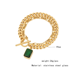 Detail view of gold double-layer necklace with green stone pendant and dimensions