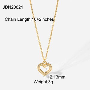 Detail view of 18K gold heart pendant with clear zircon inlay and 16+2 inch chain size