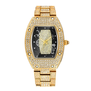 Luxurious gold tonneau watch with full diamond setting and black skeleton dial
