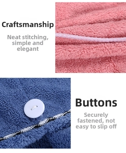 Macro detail of high-absorbent coral fleece hair towel with neat stitching and button closure