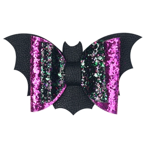 Detailed view of Halloween bat hair clip with pink and green glitter bow for girls