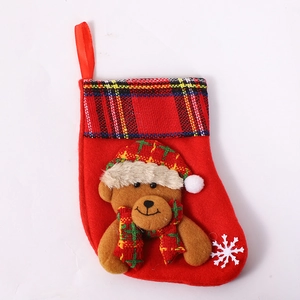Red Christmas stocking featuring a 3D cartoon bear with plaid trim and snowflake detail