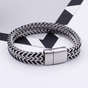 Mens double row woven stainless steel Cuban bracelet with magnetic clasp on clean background