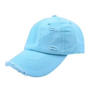 Detailed view of the distressed edges and frayed holes on a light blue cotton baseball cap