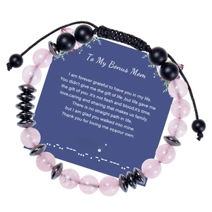Close-up of pink rose quartz and black magnetic stone Morse code gift bracelet