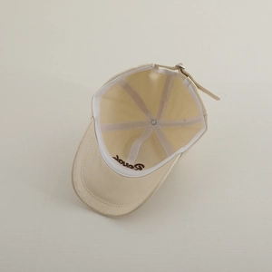 Detail view of cotton baseball cap interior with Bonds embroidery and adjustable metal strap