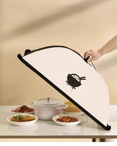 Detail of a large foldable food cover protecting 5-7 dishes with a warm home dining vibe