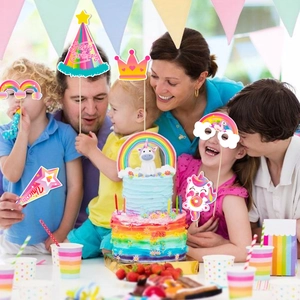 Close-up of unicorn party glasses, cake toppers, and birthday decorations for kids