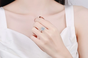 Macro detail of rectangle cushion cut moissanite ring with halo and paved band