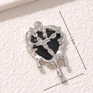 Macro detail of gothic silver heart lava pendant with precise size markings