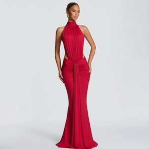 Detail of red halter neck evening gown with waist cut-outs and elegant pleated draping