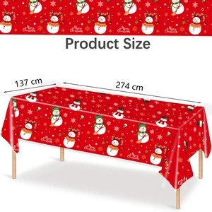Detail showing 137x274 cm red Christmas tablecloth with snowman and snowflake patterns