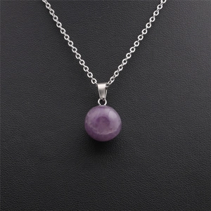 Minimalist round purple stone pendant necklace with silver chain on black leather background