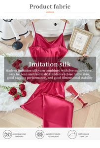 Detail of burgundy satin pajama set showing smooth fabric texture and washing instructions
