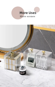 Detailed view of clear acrylic organizers with gold flower knobs and ribbed texture on vanity