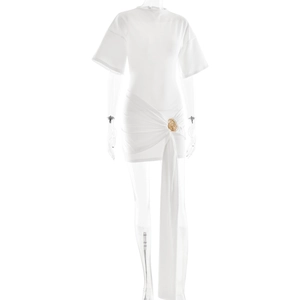 Detail of white mini dress featuring side ruching and elegant gold buckle accent