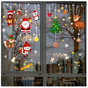 Detail of multi-colored Christmas window stickers with Santa and reindeer on glass