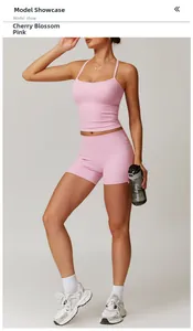 Close-up of cherry blossom pink yoga tank top and shorts set on a model in studio
