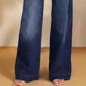 Women's high-waisted wide-leg jeans in dark blue denim featuring a raw-cut frayed hem design