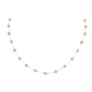 Detail of natural white pearls and gold-plated chain on minimalist necklace