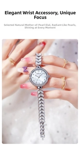Close-up of elegant silver quartz watch with mother of pearl dial and crystal bracelets