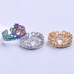 Regal crown rings in rainbow, silver, and gold steel with adjustable open bands