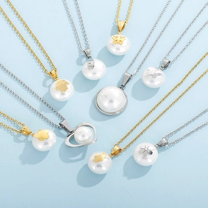 Detailed view of pearl pendants with gold and silver butterfly and flower charms on necklaces