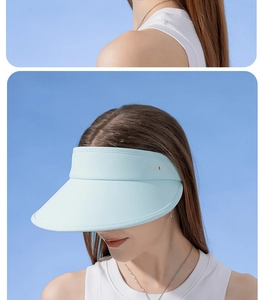 UPF50+ sun visor hat in light blue showing front and side views on model for UV protection