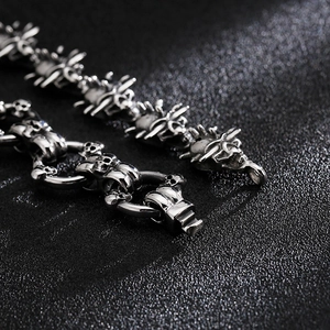 Macro detail of punk skull link chain and clasp in retro silver stainless steel