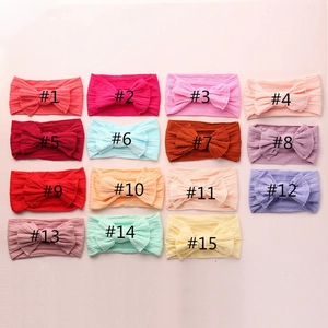 Detail view of jacquard nylon baby headbands with bows in 15 assorted colors