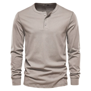 Detailed view of grey-brown long sleeve Henley shirt with three buttons and cotton texture
