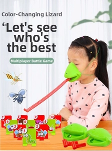 Girl wearing green chameleon mask playing tongue out tabletop battle game with targets