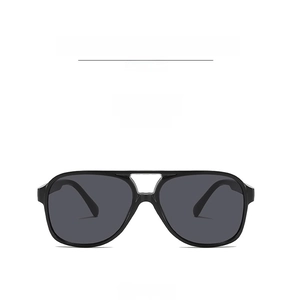 Detail view of double bridge aviator sunglasses with black frames and grey lenses