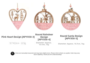 Detailed view of pink painted wooden Christmas ornaments with hollow reindeer designs