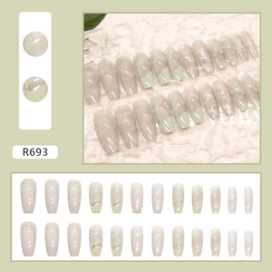 Detail of Morandi green and cream coffin press-on nails with glitter and silver accents