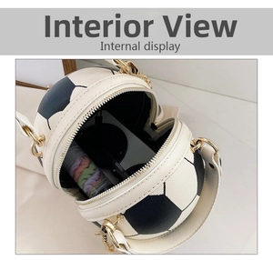 Internal view of a football-shaped crossbody bag showing capacity for sunglasses and makeup