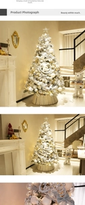 Detail of luxury silver-white Christmas tree with ornaments and star topper in home setting