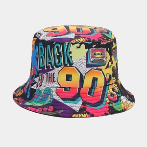 Detail of 90s vintage graffiti bucket hat featuring retro cassette and skate patterns