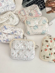 Quilted floral mini pouches with snap buttons for coins and accessories in a variety of patterns