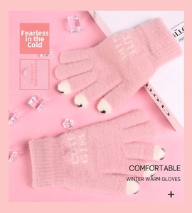 Detail of pink faux mink gloves with CUTE GIRL text and touchscreen fingertips