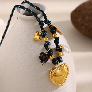 18K gold plated woven cord necklace with large heart pendant and flower bead accents