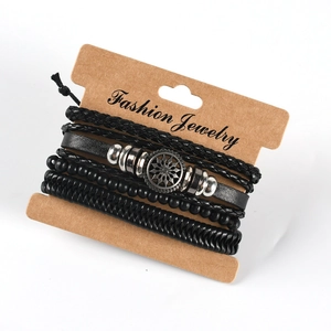 Detail view of multilayer leather bracelet with wooden beads on kraft paper card