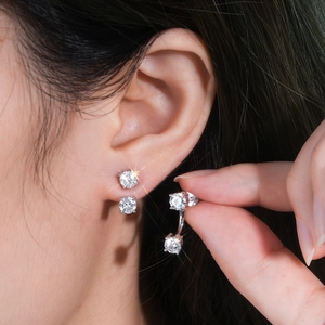 Close-up of S925 silver moissanite earrings showing a dual-wear design on the model