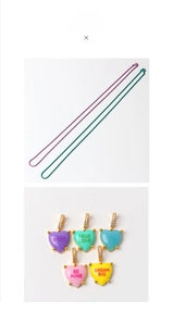 Detail of colorful enamel heart pendants with engraved text and matching cable chains